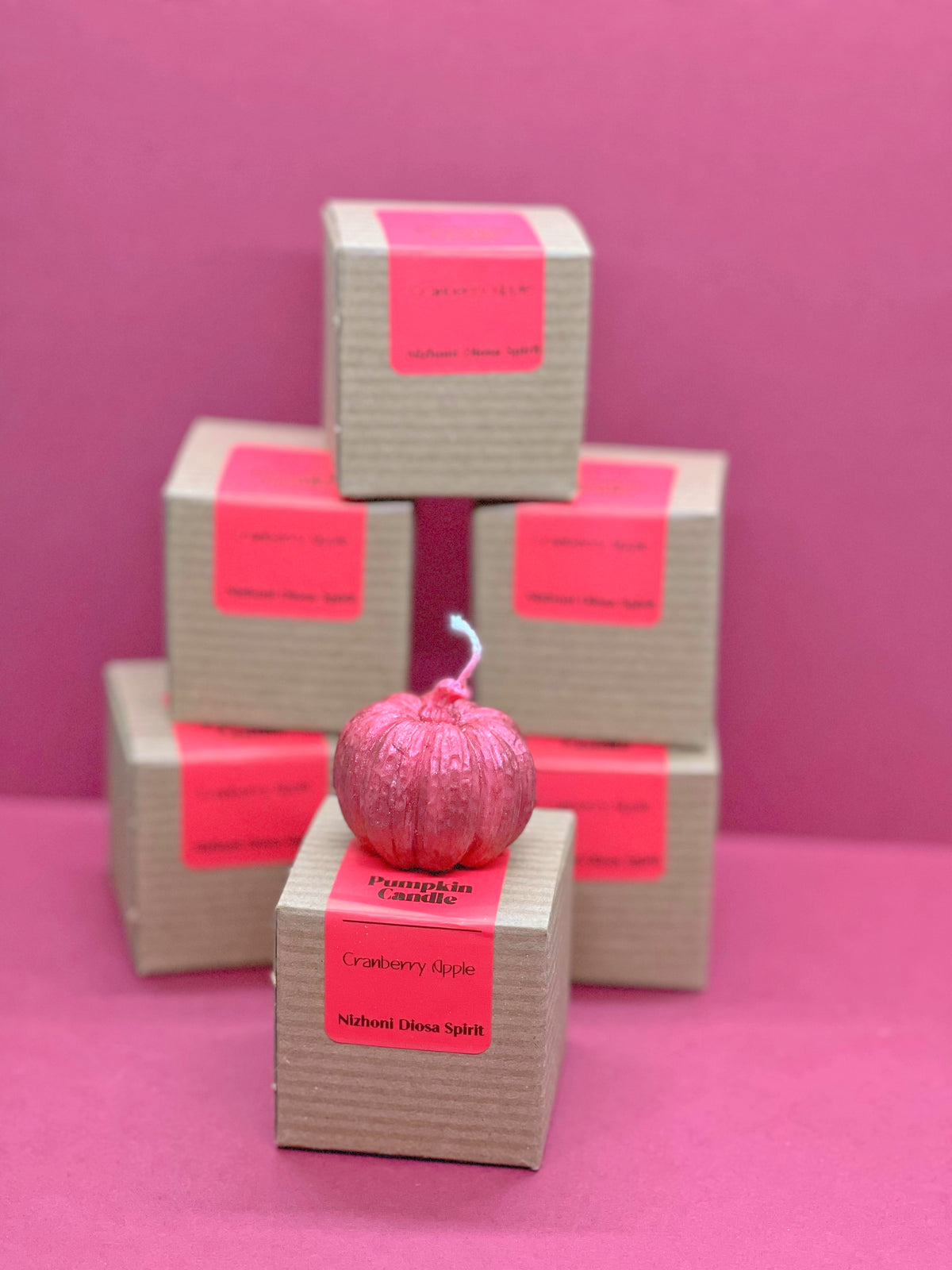 Red mini pumpkin candle with Cranberry Apple scent for cozy autumn evenings